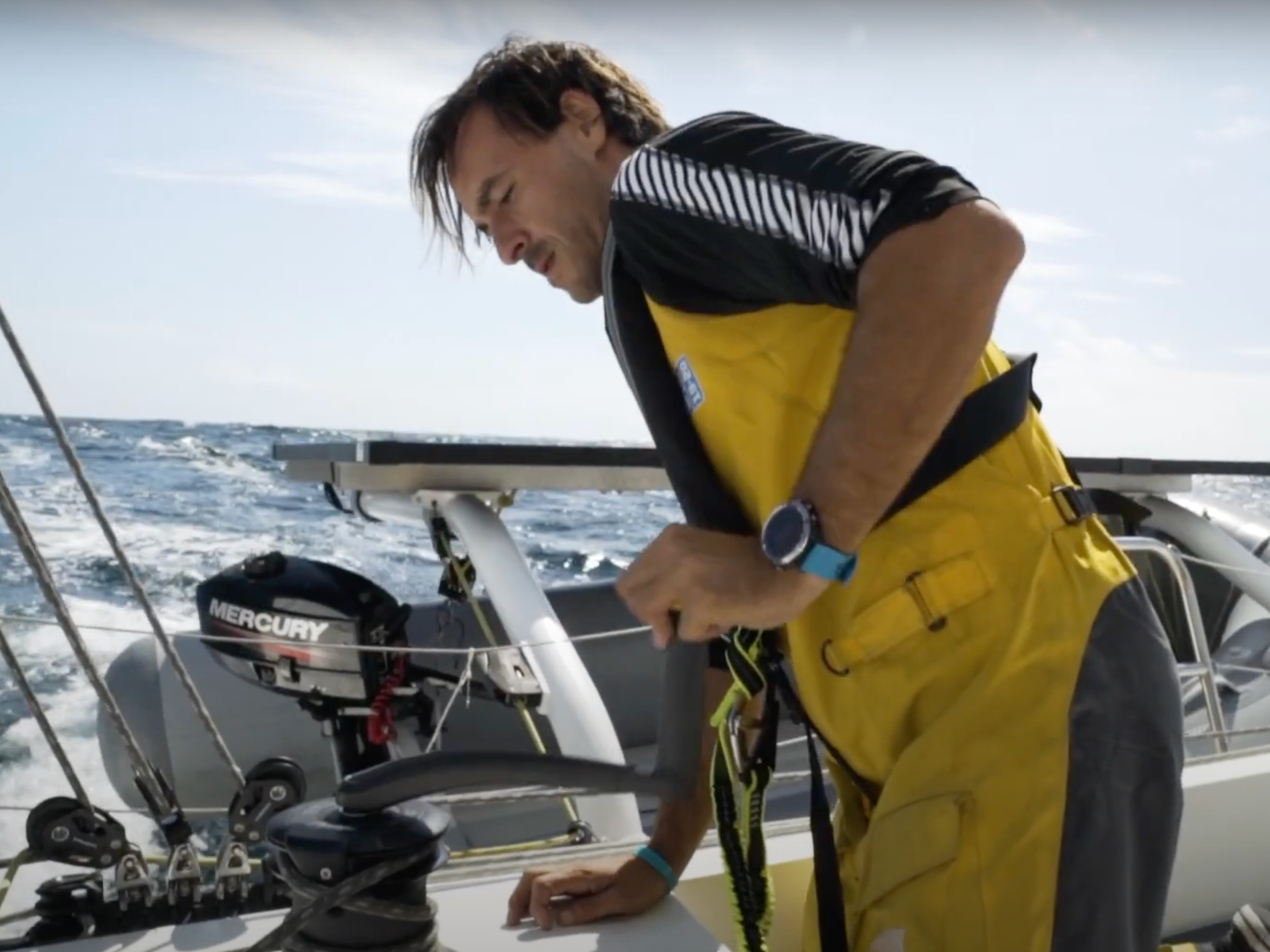 Sailor grinding a winch